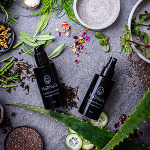 The Cleansing Ritual by Matinata: re.purify cleansing oil and re.balance face mist in black glass bottles on grey stone with rosemary, aloe and botanicals