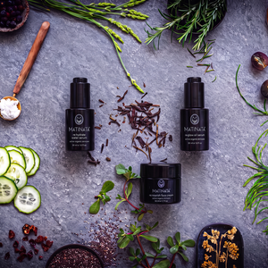 The Hydration + Glow Ritual by Matinata: re.hydrate serum, re.glow face oil and re.nourish moisturiser on grey stone with botanicals