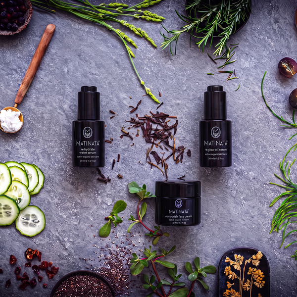 The Hydration + Glow Ritual by Matinata: re.hydrate serum, re.glow face oil and re.nourish moisturiser on grey stone with botanicals